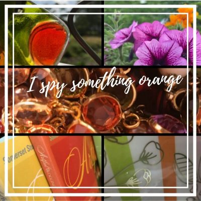 Collage of orange items - flowers, glass, jewelry