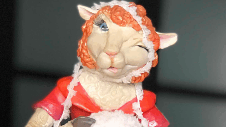 Close up of face of sculpture of sheep knitting